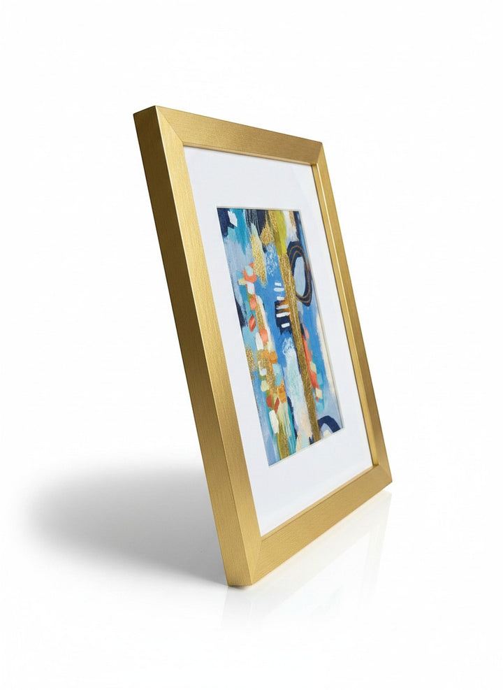 Chic Collective abstract artwork with coral, ivory, navy, sage, and sky blue hues, gold accents, and a gold frame.