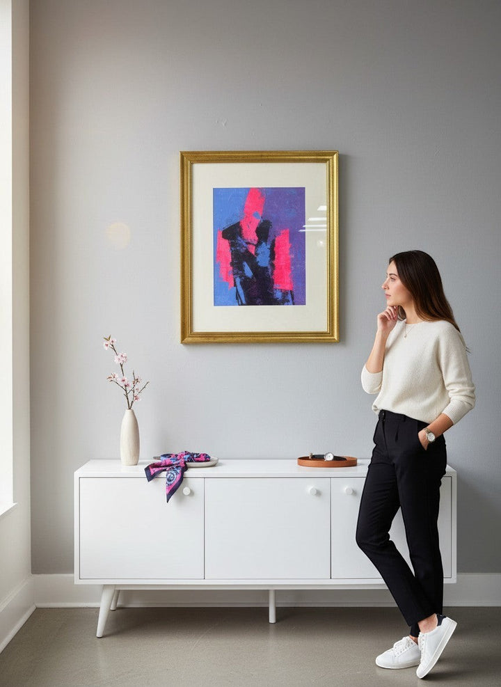 Chic Collective abstract figure wall art in gold frame with pink, blue, and black colors. Modern decor.