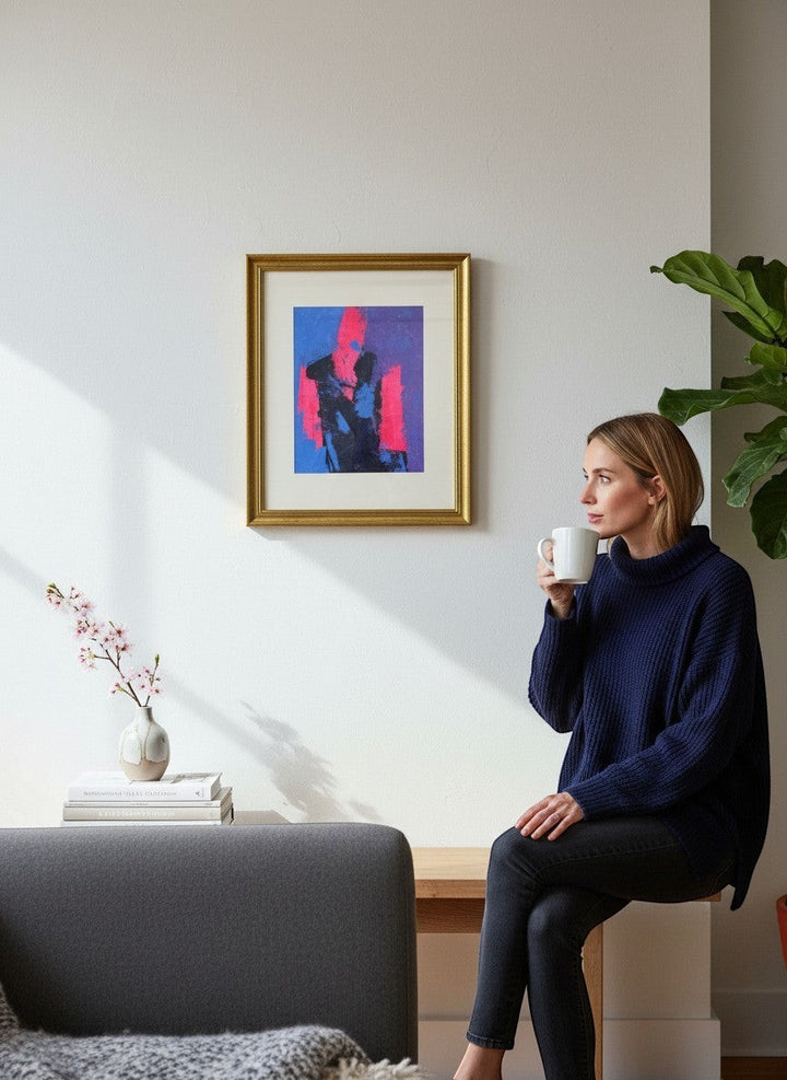 Chic Collective abstract figure wall art in pink, blue, and black, framed in gold.