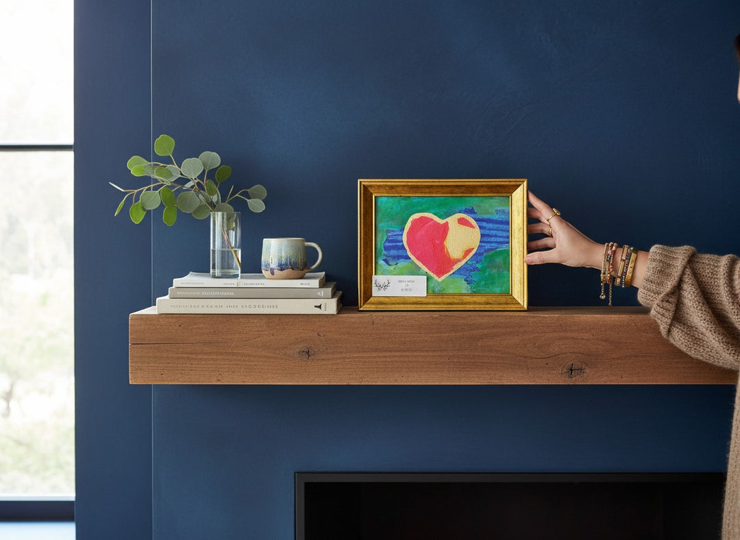 Chic Collective abstract art print of a heart in red and gold on a textured blue and green background, framed in gold.