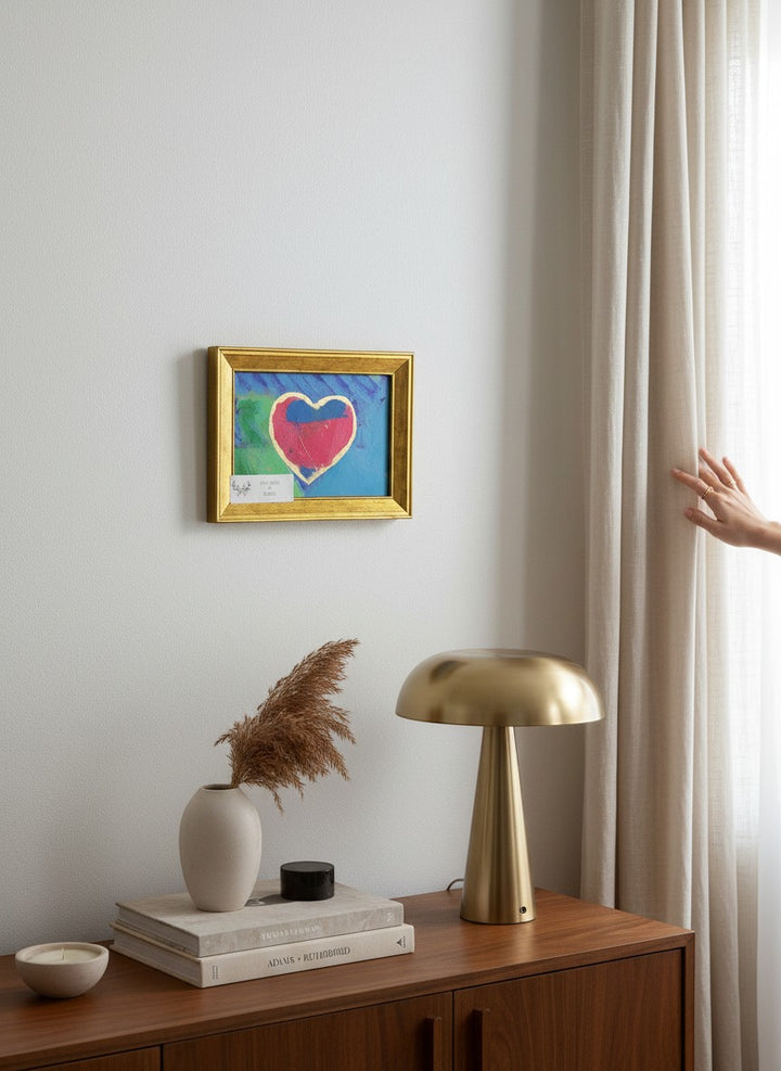 Chic Collective abstract painting of a pink heart with gold trim on turquoise and blue background, framed in gold.