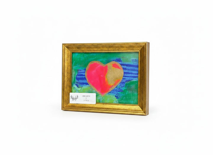 Chic Collective abstract heart painting with pink, gold, blue, and green textures. Framed art.