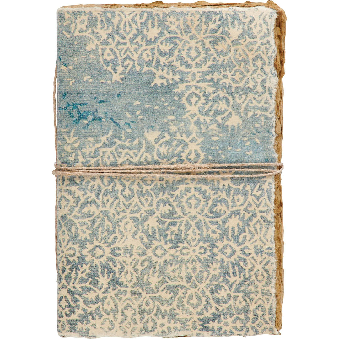 Chic Collective artisan journal with decorative blue and cream pattern binding, deckled edges, and twine closure.