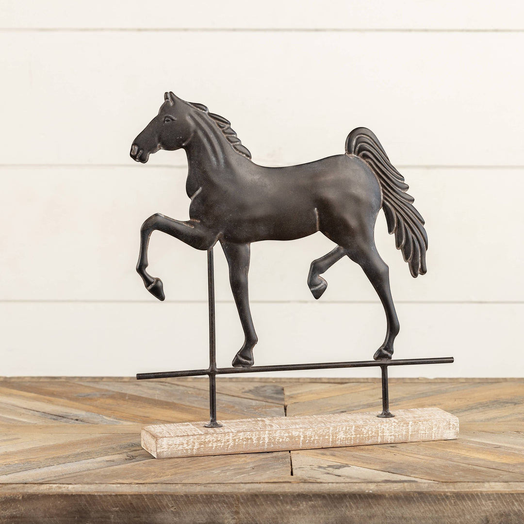 Chic Collective black metal horse sculpture on a distressed wood base with metal stand, 13.5" tall.