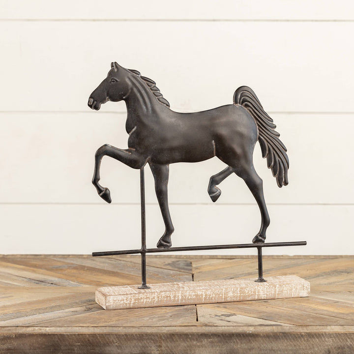 Chic Collective black metal horse sculpture on a distressed wood base with metal stand, 13.5" tall.