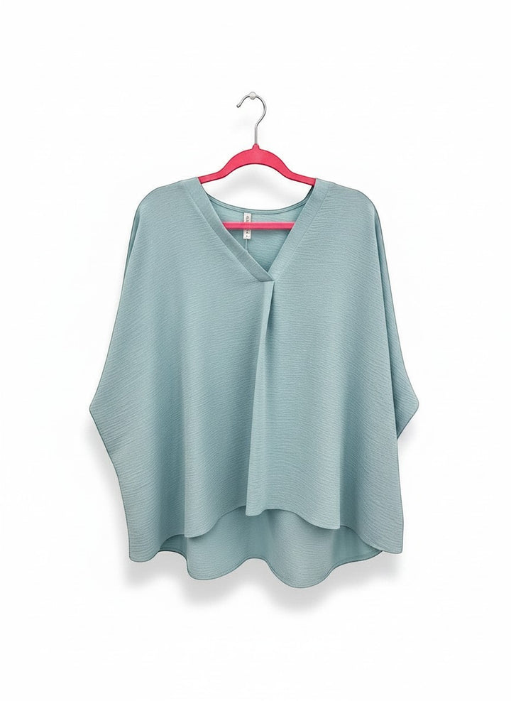 Chic Collective light blue textured V-neck dolman top with relaxed sleeves and a flattering drape.