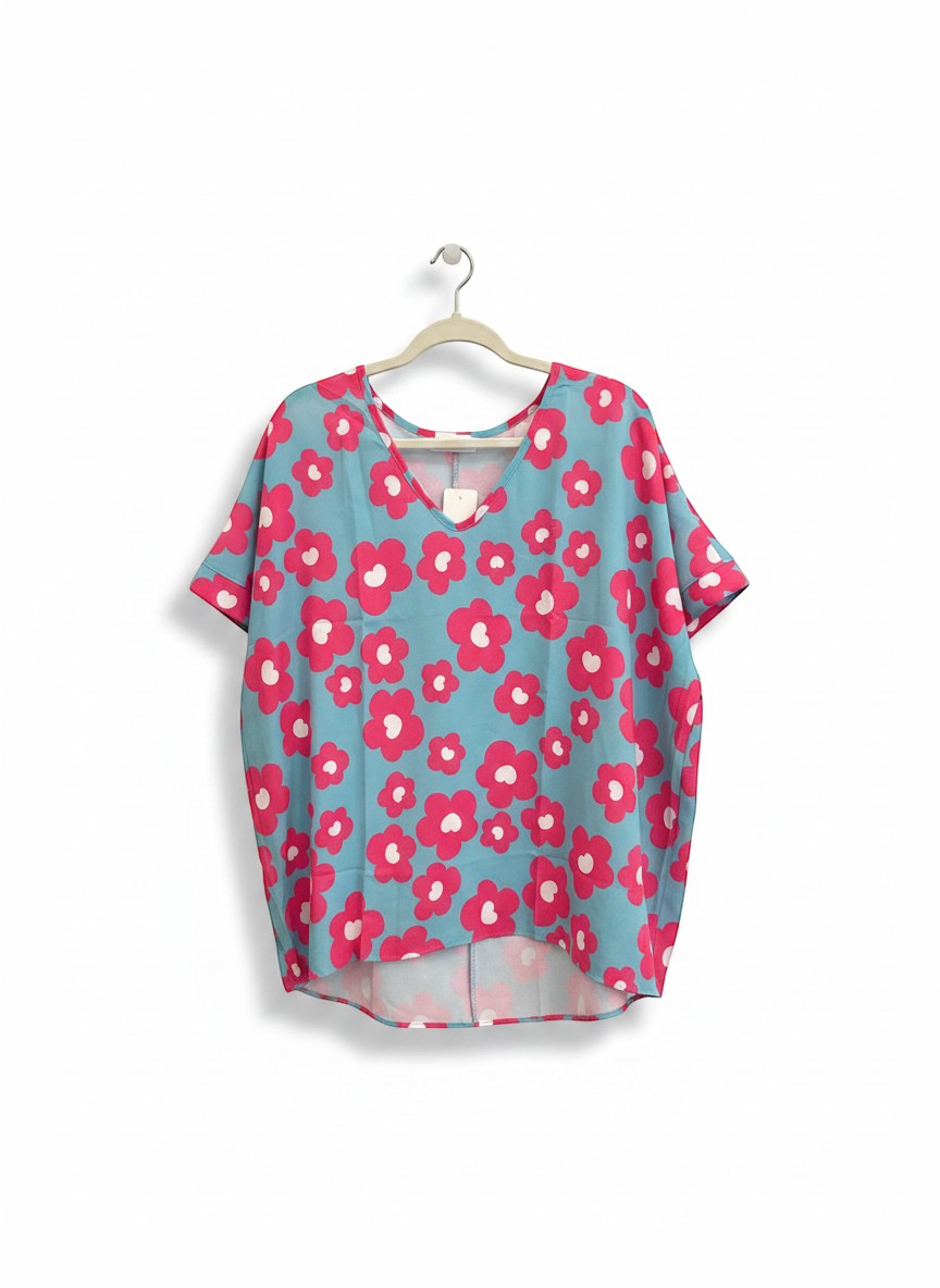 Chic Collective blue V-neck top with bold pink and white floral print, short cuffed sleeves.