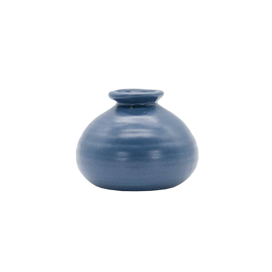 Chic Collective Mattie blue stoneware ribbed bud vase, perfect for single blooms or dried florals. Features a matte glaze and watertight design.