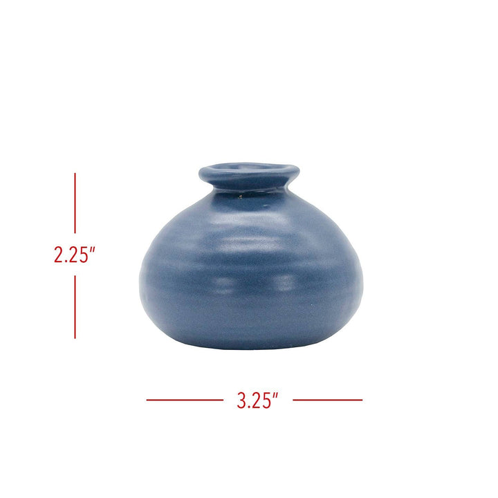 Chic Collective Mattie blue stoneware bud vase with matte glaze and ribbed texture. Perfect for single blooms or dried florals.