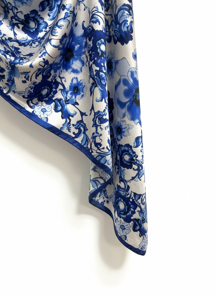 Chic Collective Blue Willow Bloom Scarf: Ivory silk scarf with intricate cobalt blue floral pattern and border.