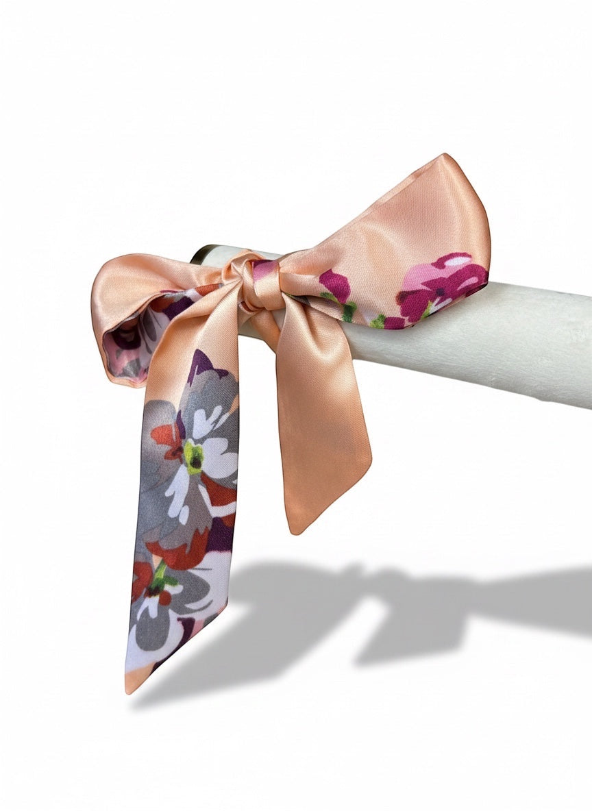 Chic Collective Blush Bloom Ribbon Tie, a silky accessory with floral print in blush, plum, ivory, and coral.