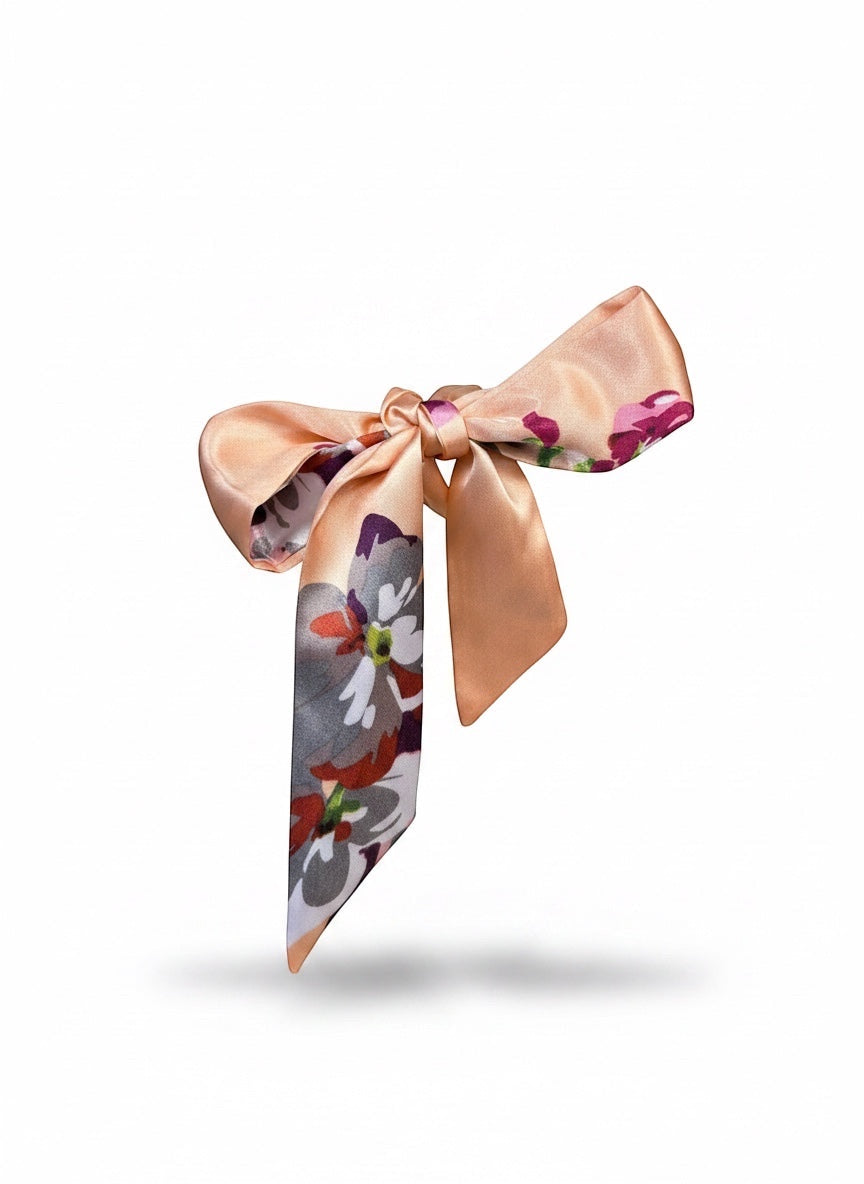 Chic Collective Blush Bloom Ribbon Tie, a silky satin accessory with floral watercolor print in blush, plum, ivory, and coral.