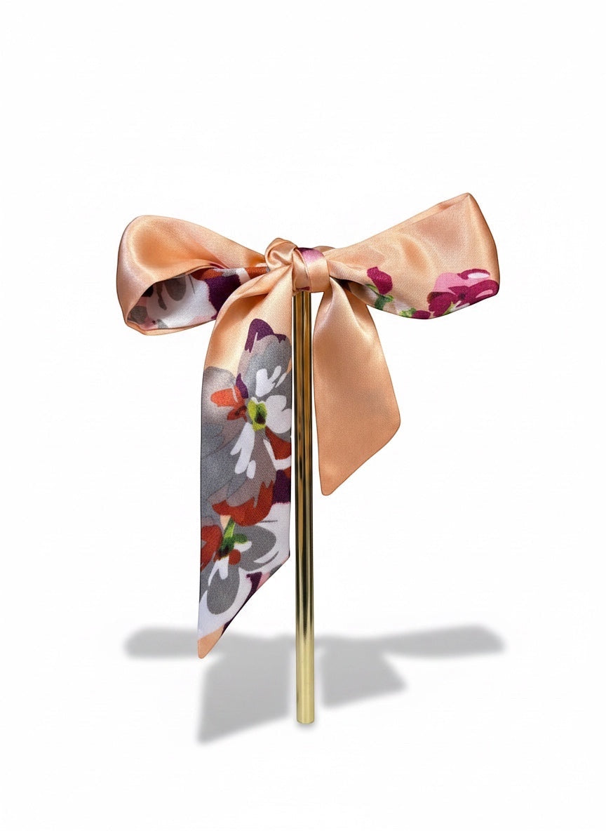 Chic Collective Blush Bloom Ribbon Tie, a satin hair accessory with floral print in blush, plum, ivory, and coral.