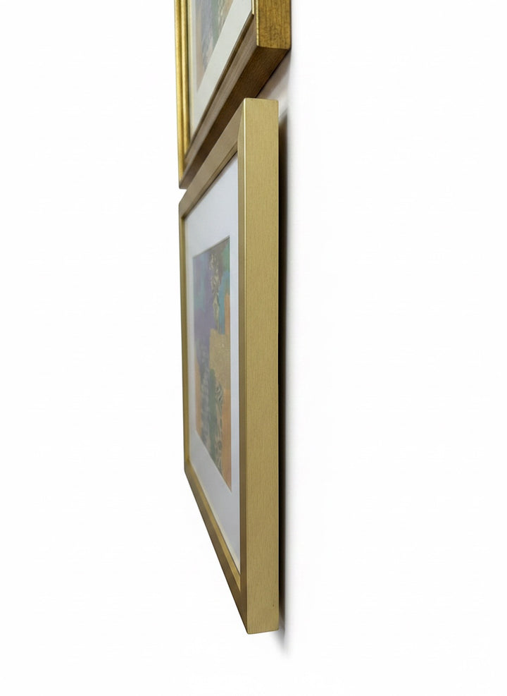 Chic Collective Botanical Reverie abstract art with violet, turquoise, blush, emerald green, ochre, and gold accents in a gold frame.