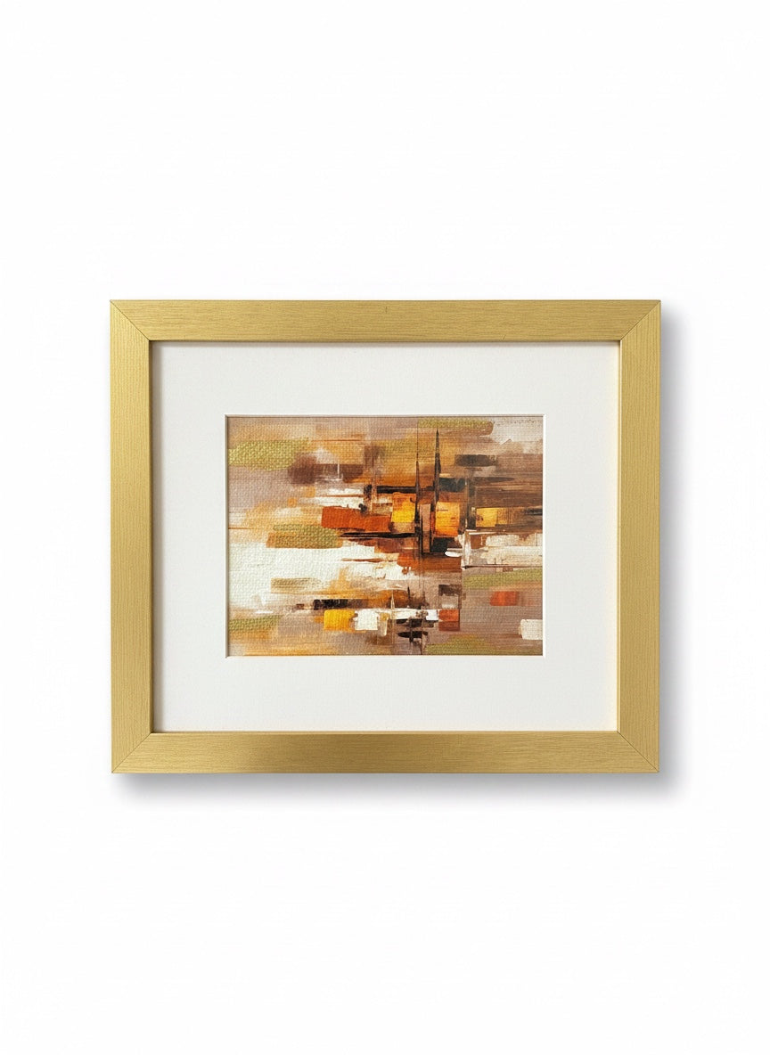 Chic Collective City Lights at Dusk abstract painting with warm caramel, ivory, gold, and espresso tones in a gold frame.