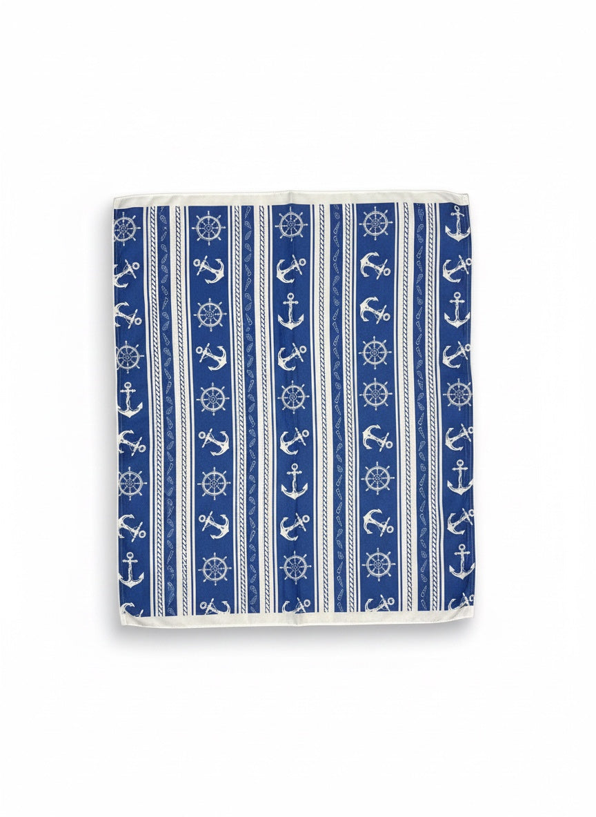 Chic Collective Coastal blue scarf with white anchors, ship wheels, and rope pattern. Lightweight nautical accessory.