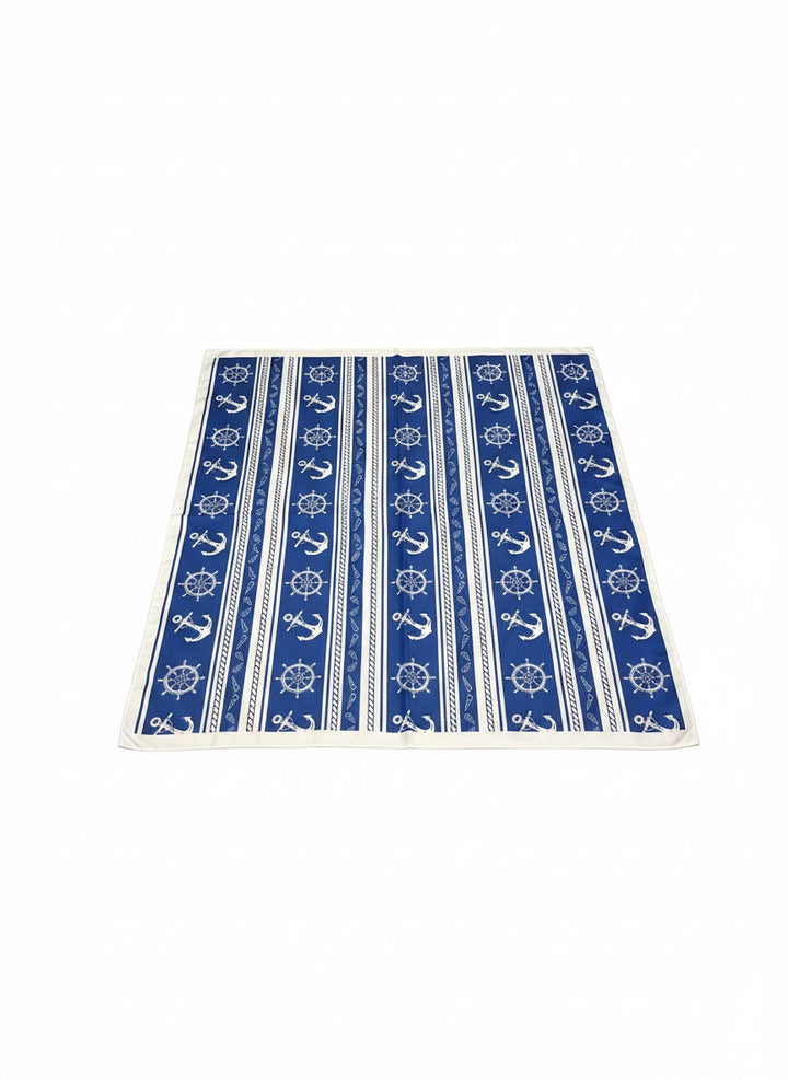 Chic Collective Coastal blue scarf with white anchors, ship wheels, rope, and stripes. Lightweight nautical accessory.