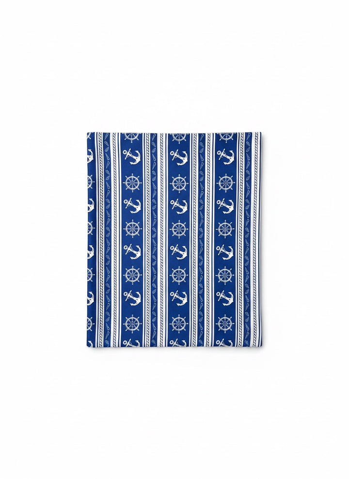 Chic Collective Coastal blue scarf with white anchors, ship wheels, rope, and stripes. Lightweight nautical accessory.