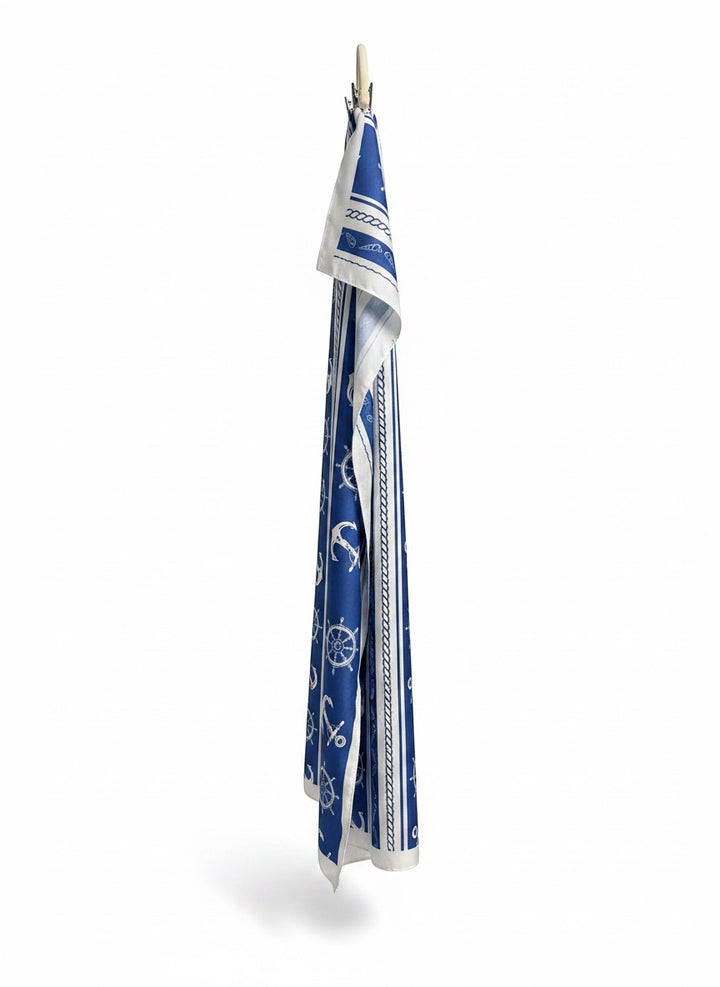 Chic Collective Coastal blue scarf with ivory anchors, ship wheels, rope, and stripes. Lightweight nautical accessory.