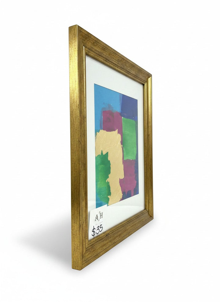 Chic Collective Color Theory in Gold framed abstract art with gold leaf accents and vibrant blocks of blue, green, orchid, and turquoise.