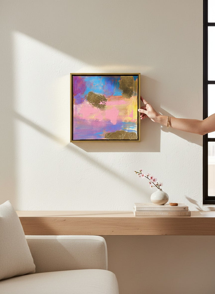 Chic Collective Cotton Candy Skies abstract painting with pink, lavender, blue, and gold accents, framed in gold.