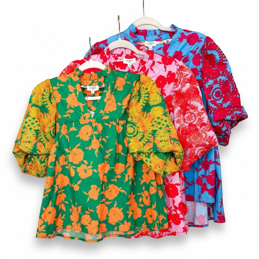 Chic Collective embroidered tops in green with orange floral print, pink with red floral print, and blue with red floral print. V-neck, puff sleeves.