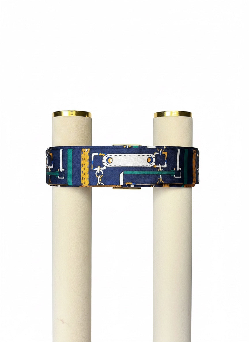 Chic Collective navy satin ribbon tie with gold, ivory, and emerald harness print. Versatile accessory.