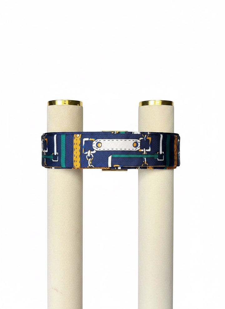 Chic Collective navy satin ribbon tie with gold, ivory, and emerald harness print. Versatile accessory.