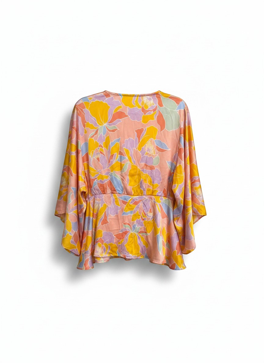 Chic Collective floral print peplum blouse with V-neckline, kimono sleeves, and cinched waist in peach, yellow, lavender, and blue.