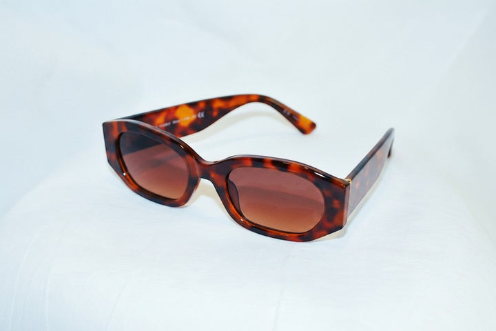 Chic Collective geometric frame sunglasses with tortoise shell pattern and gradient brown lenses.
