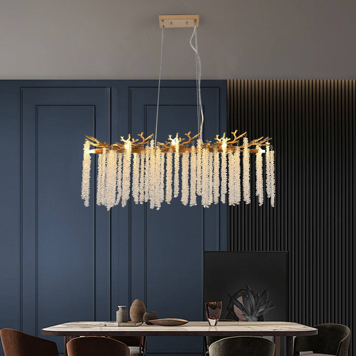 Chic Collective modern gold rectangular pendant light with cascading crystal strands, ideal for dining rooms.