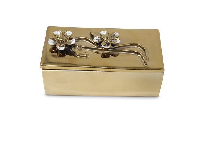 Chic Collective oblong gold decorative box with flower design lid, made of metal with a shiny finish.