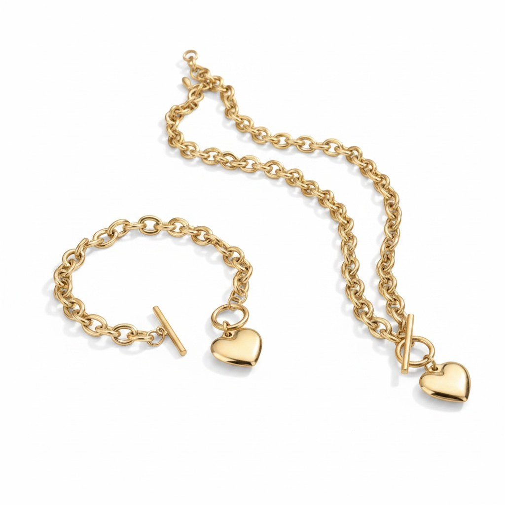 Chic Collective gold-tone metal chunky link chain necklace and bracelet set with heart charms and toggle clasps.
