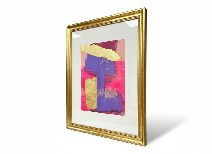 Chic Collective Golden Divide abstract art with fuchsia, violet, and gold leaf accents, framed in gold.