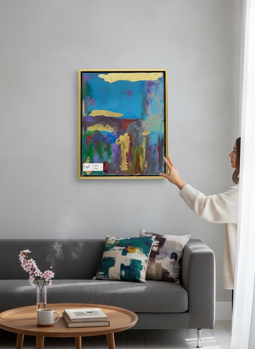 Chic Collective Golden Echoes abstract painting with teal, plum, green, lavender, and gold leaf accents. Framed in gold.