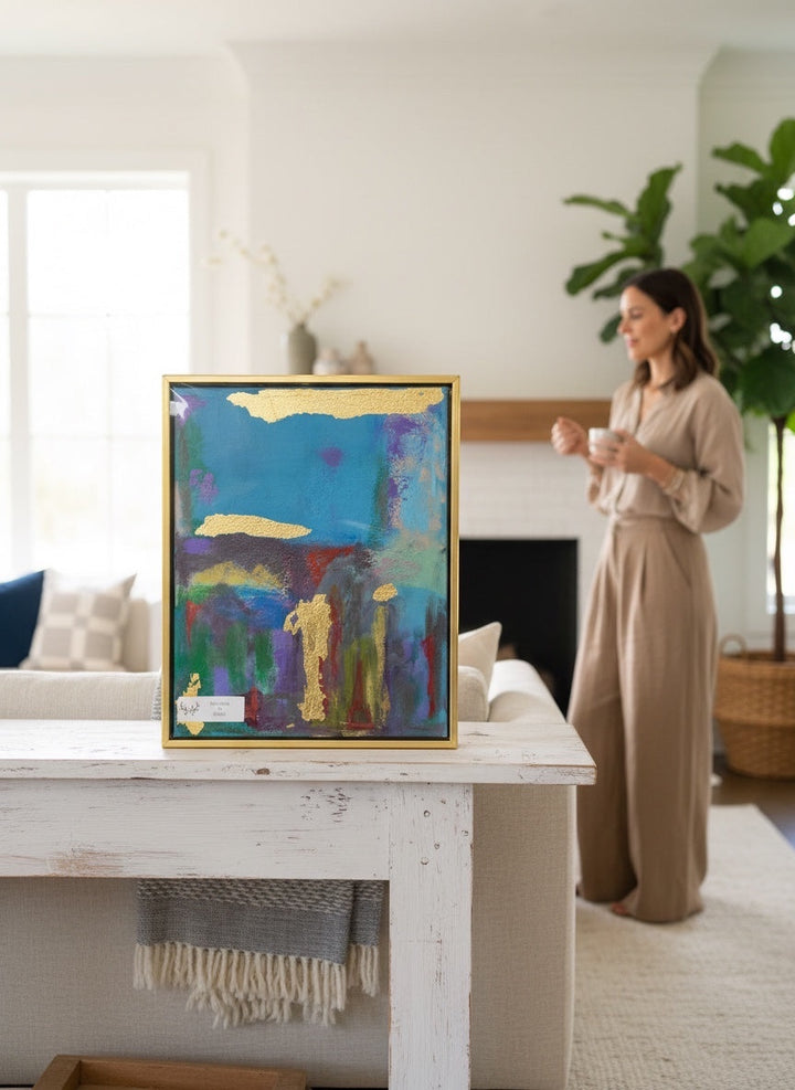 Chic Collective Golden Echoes abstract painting with teal, plum, green, lavender washes and gold leaf accents. Framed in gold.