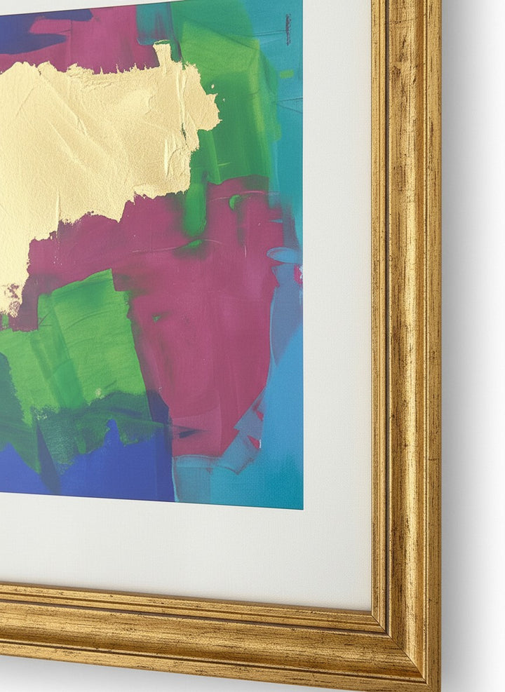 Chic Collective Golden Interruption abstract painting with gold leaf, cobalt, emerald, turquoise, and orchid colors, framed in gold.