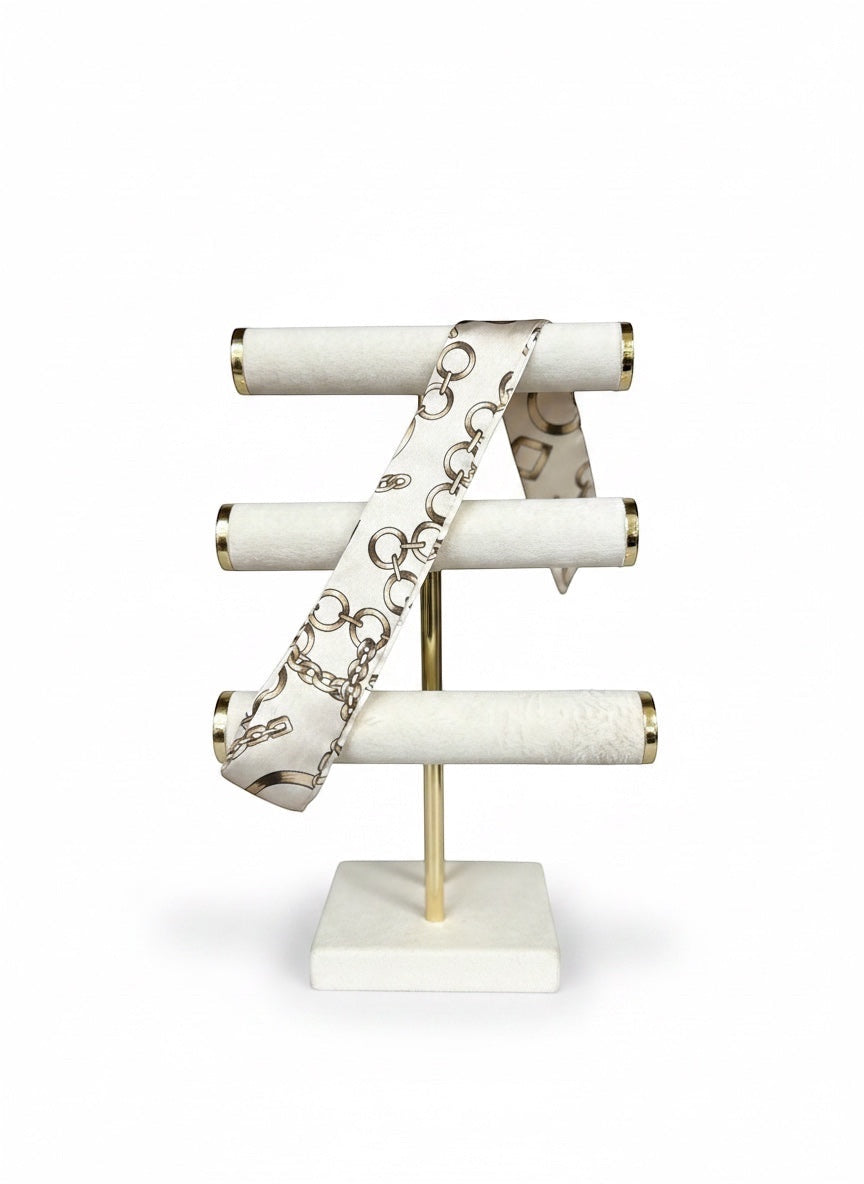 Chic Collective Golden Link Ribbon Tie, a silky scarf with a chain-link print in ivory and gold tones.