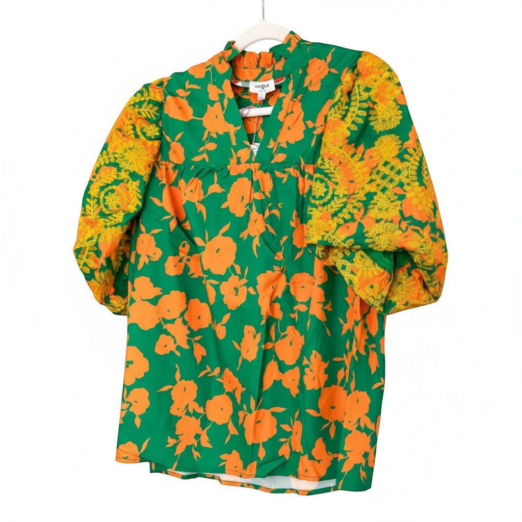 Chic Collective green top with orange floral print and yellow embroidered sleeves. Features a V-neck and puff sleeves.