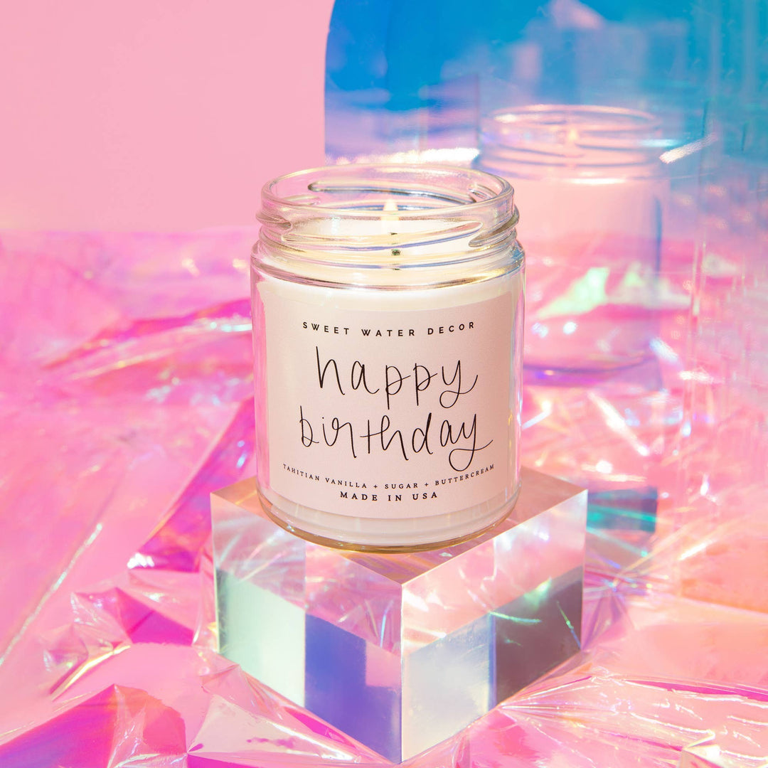 Chic Collective Happy Birthday vanilla buttercream scented soy candle in a clear jar with a pink label.