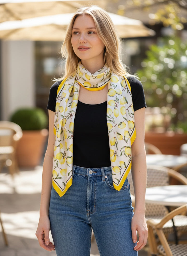 Chic Collective ivory satin scarf with yellow lemons and green leaves print, yellow border.