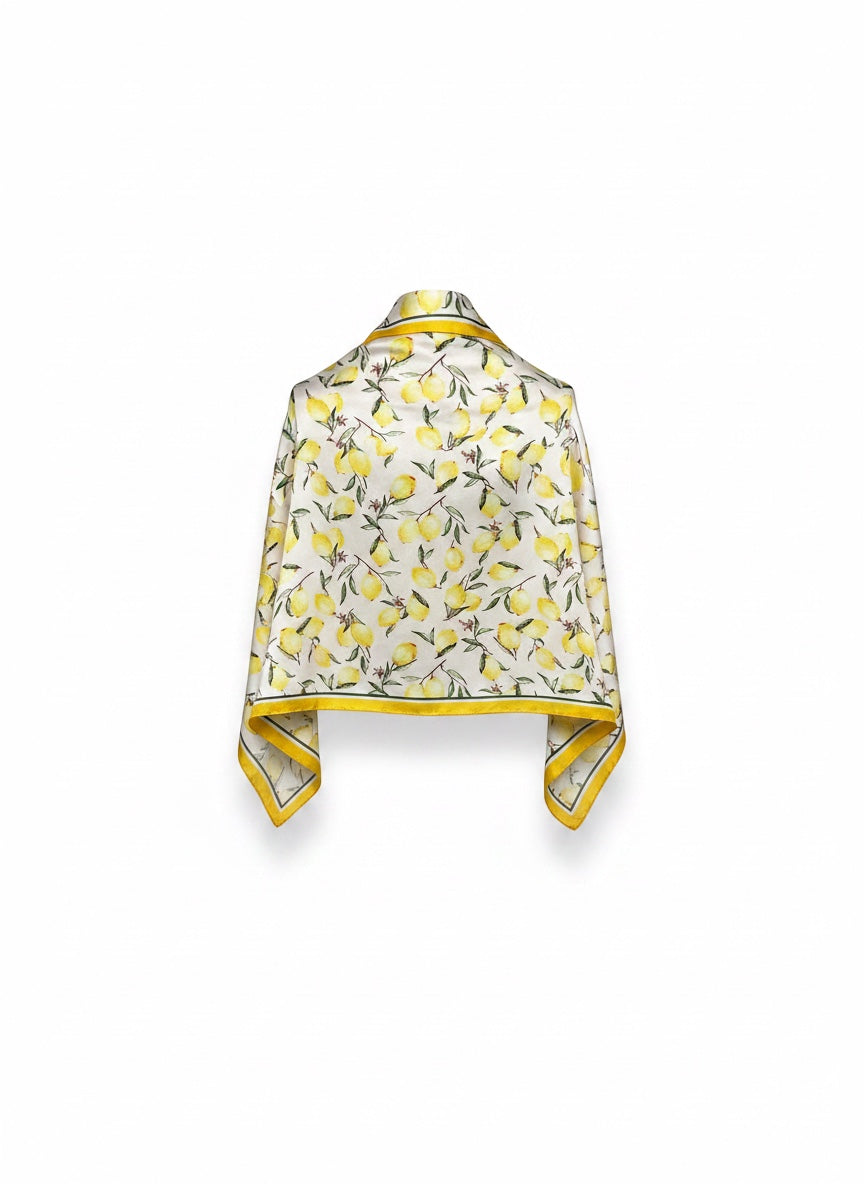 Chic Collective ivory satin scarf with watercolor lemons and green leaves, yellow border. Lightweight and silky.