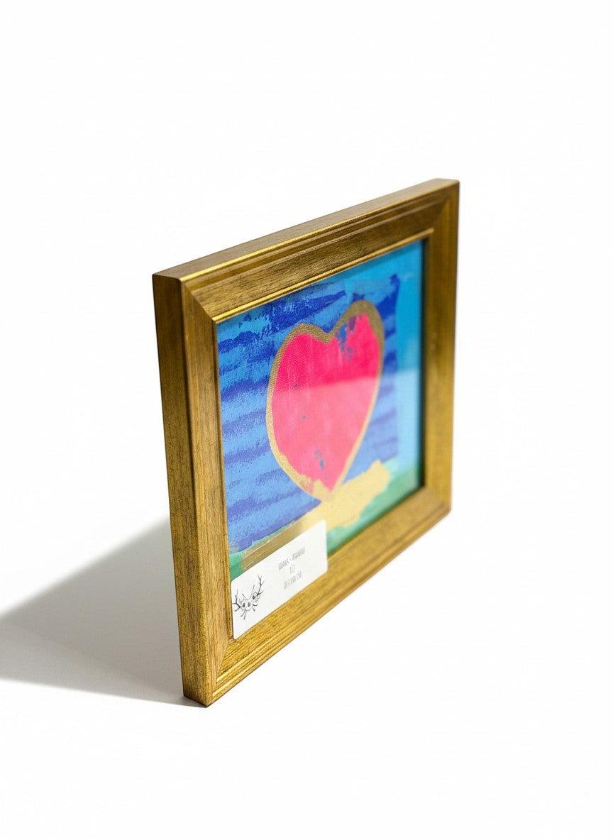 Chic Collective Love Notes framed abstract art with a pink heart outlined in gold on a blue background.