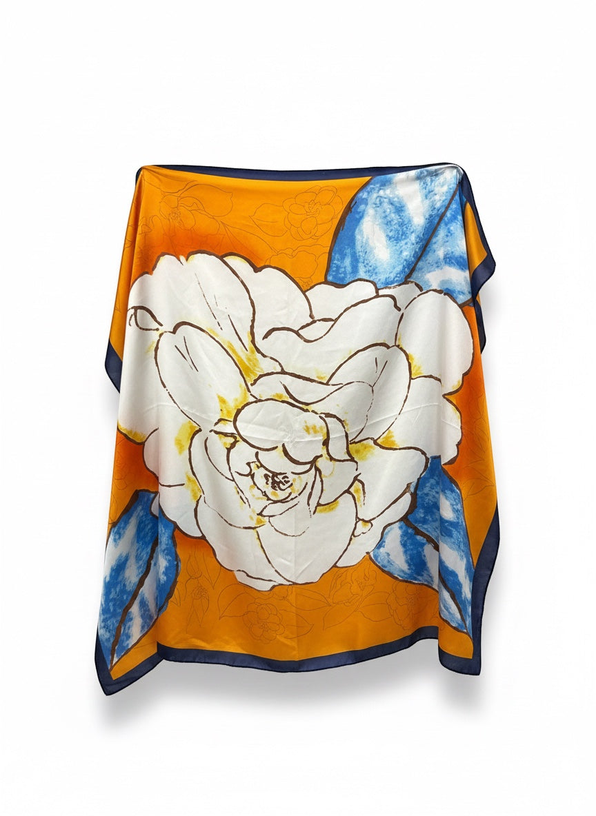 Chic Collective Marigold Bloom Scarf: Oversized ivory floral on marigold orange with blue accents. Lightweight silk.