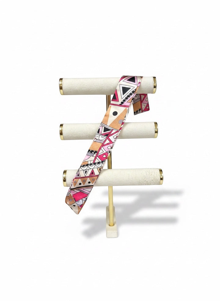 Chic Collective Marrakech Muse Ribbon Tie, a silky satin scarf with geometric print in blush pink, magenta, camel, and lavender.