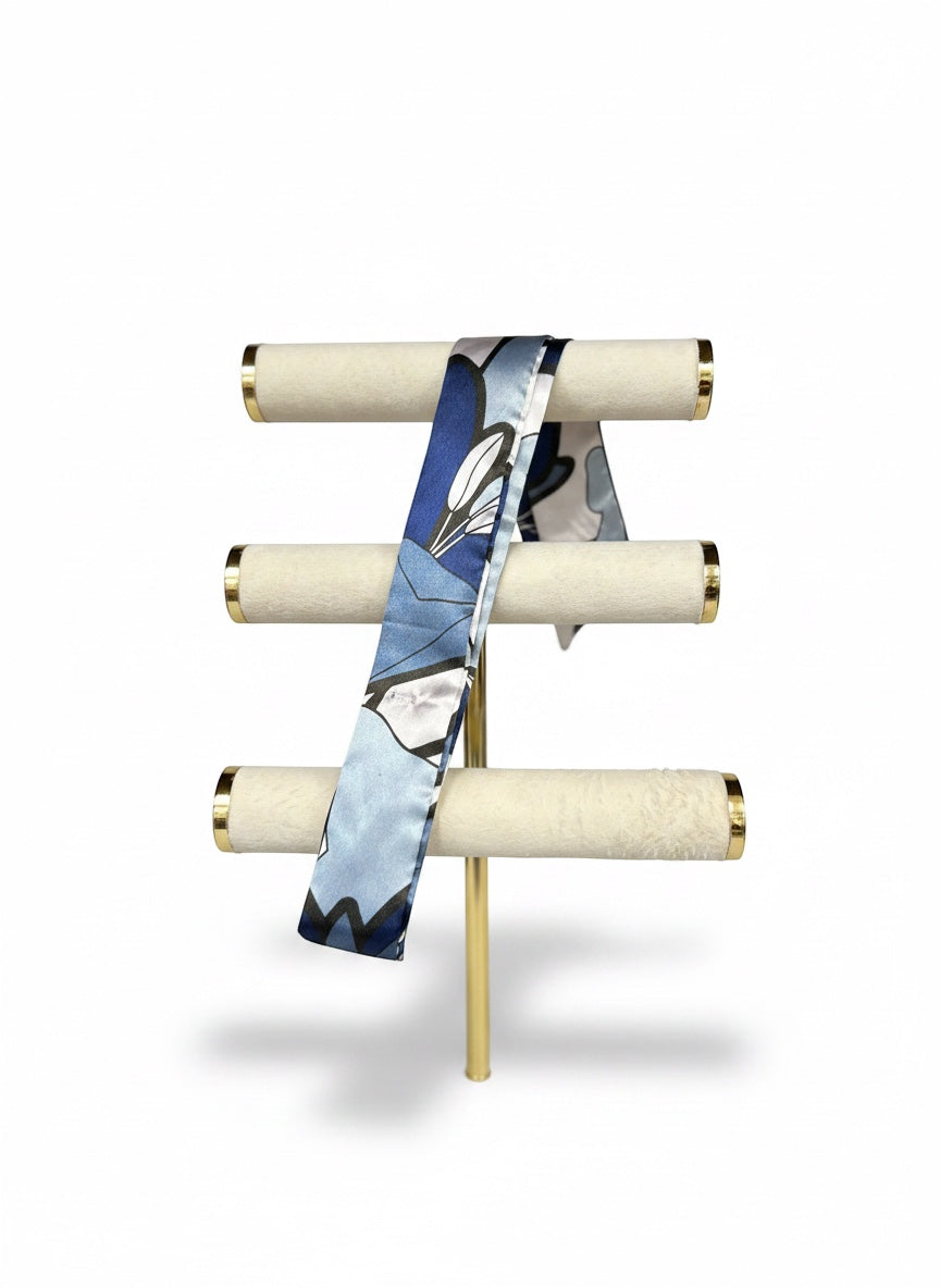 Chic Collective Midnight Bloom Ribbon Tie, a silky scarf with abstract floral details in navy, powder blue, ivory, and black.