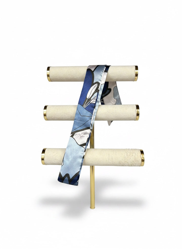 Chic Collective Midnight Bloom Ribbon Tie, a silky scarf with abstract floral details in navy, powder blue, ivory, and black.