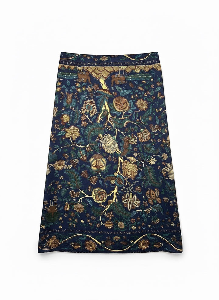 Chic Collective Midnight Garden Scarf: Navy blue scarf with intricate floral, vine, and woodland motifs in teal, gold, and olive.