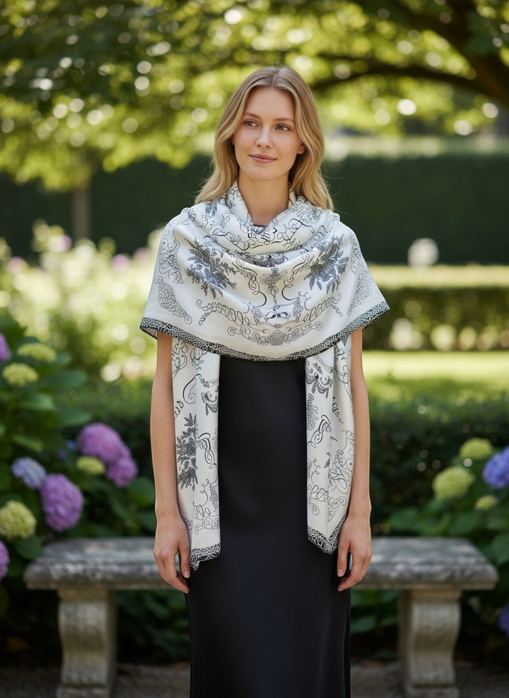 Chic Collective ivory satin scarf with black ornamental detailing and botanical motifs. A sophisticated accessory.