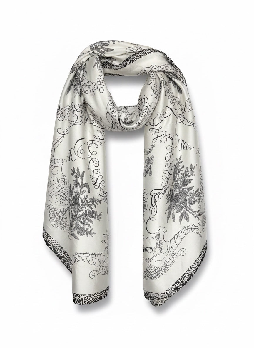 Chic Collective The Midnight Manor Scarf: ivory satin with black ornamental floral and script detailing.